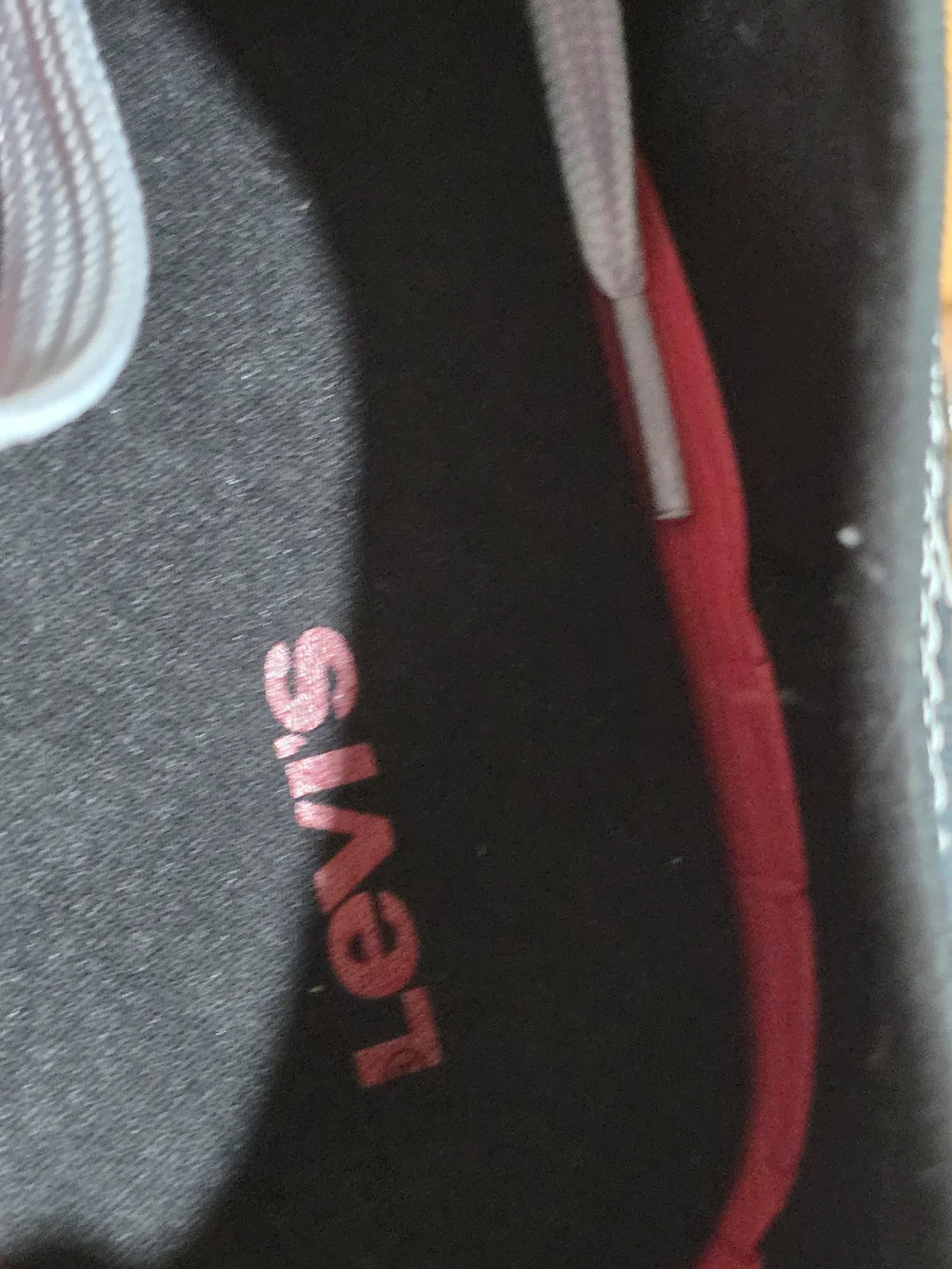 Levi's Men's Black Canvas Low-Top Sneakers with White Accents and Red Tab
